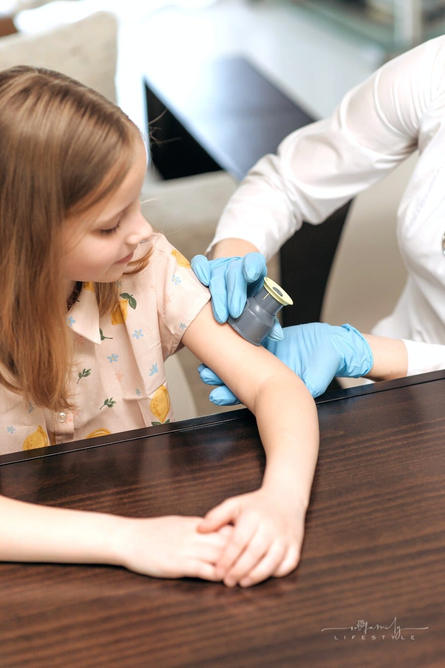 pediatrician checking blood sugar of patient