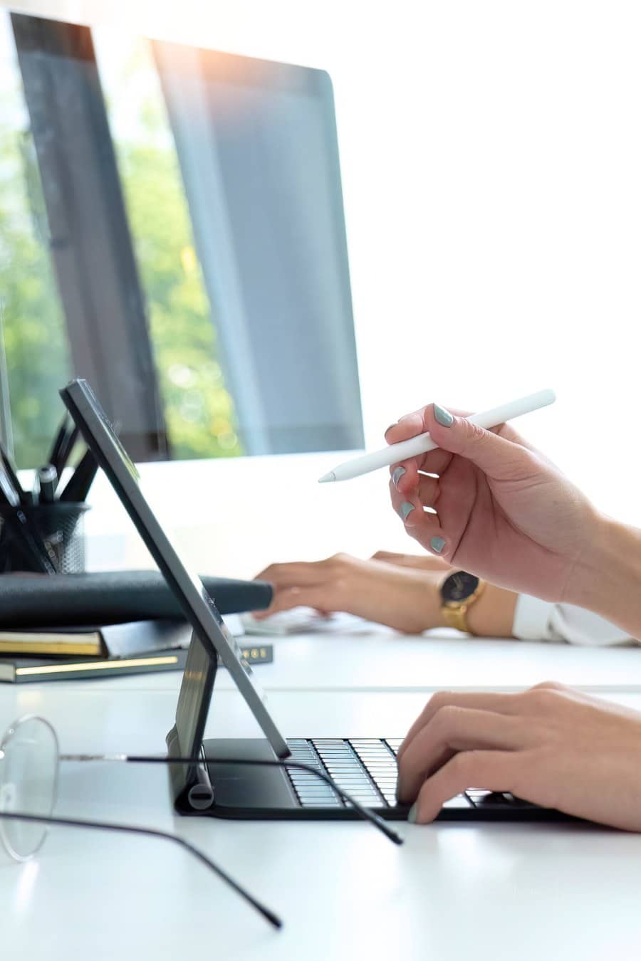graphic designer working on tablet with stylus pen