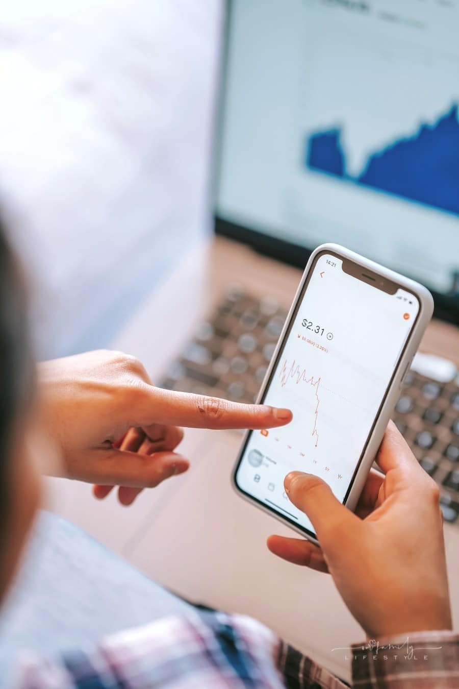 4 Ways to Prepare for Retirement woman looking at stocks on mobile app