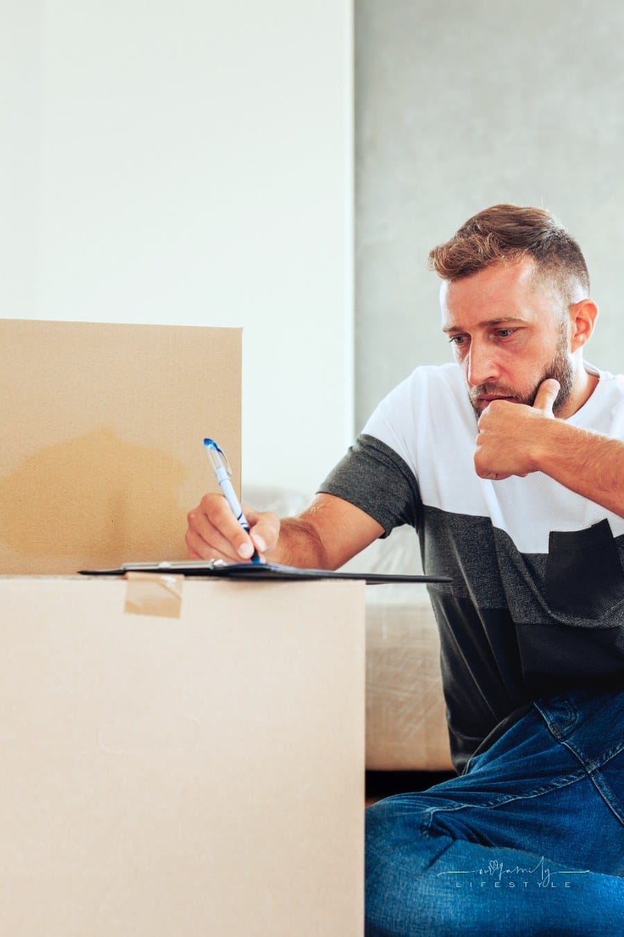 man making a checklist to help move go smoother