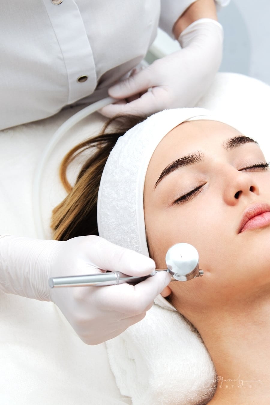 woman getting face beauty treatment in medical spa