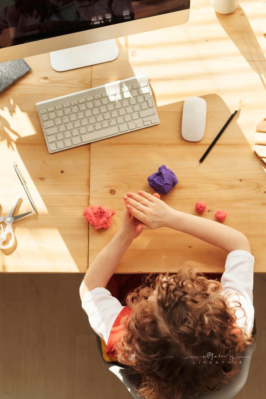 Child Playing With Kinetic Sand