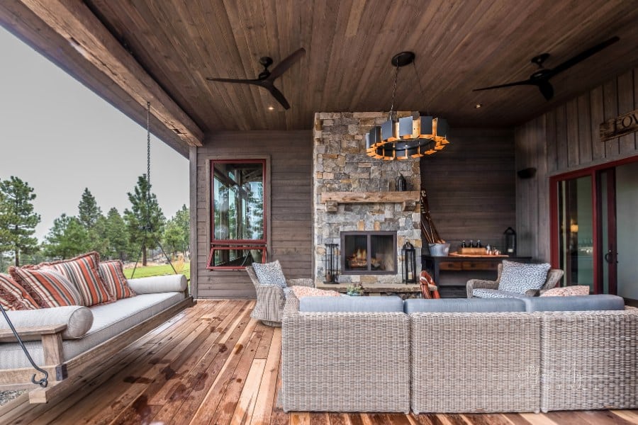 Porch swing under covered patio on a rainy day