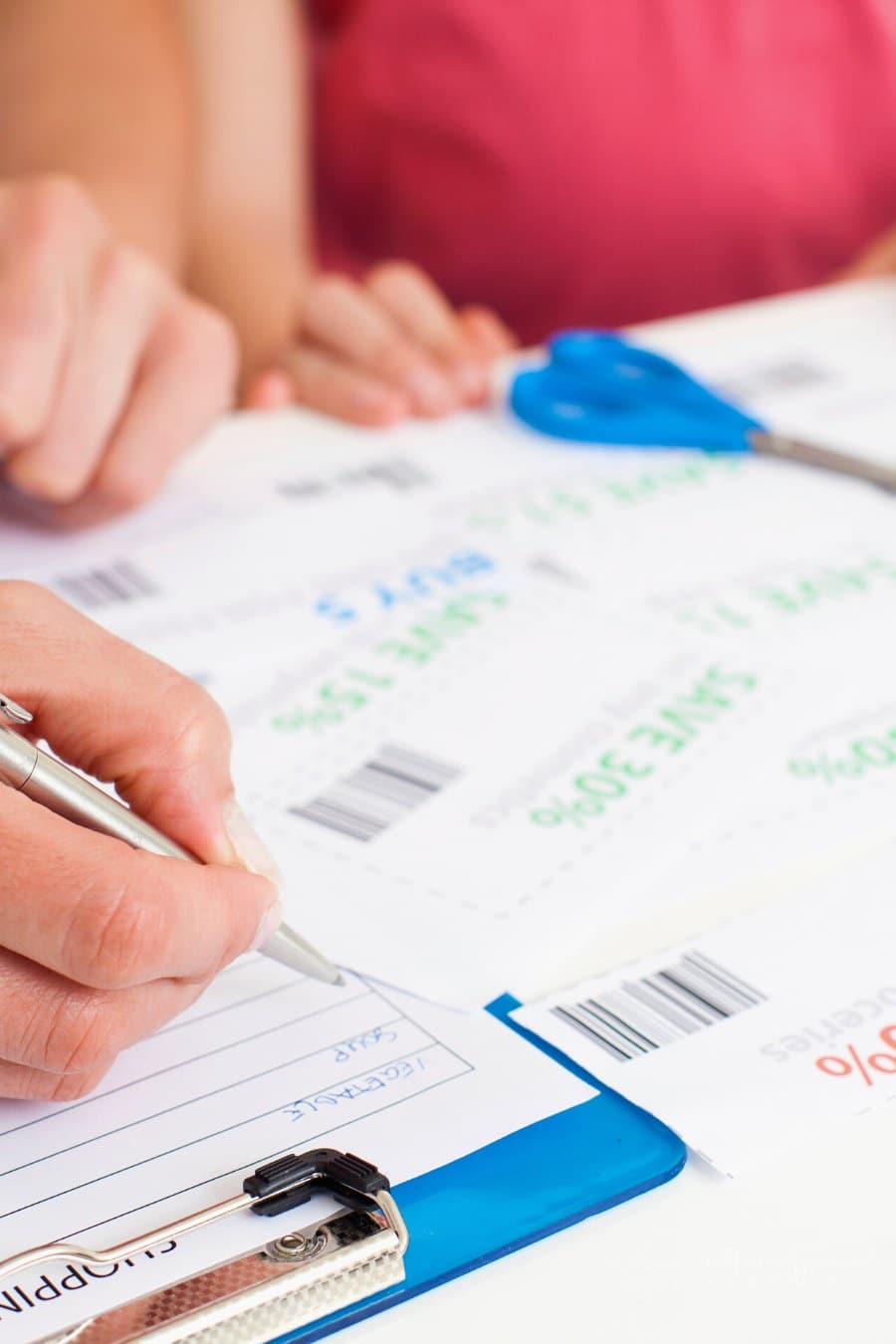 mom listing coupons for grocery shopping