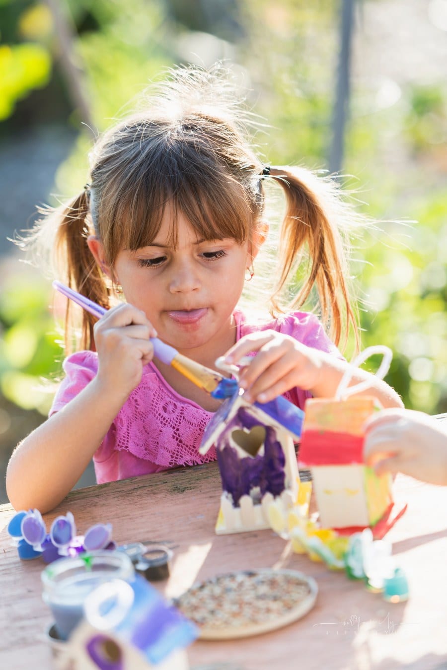 child working on arts and crafts at summer camp