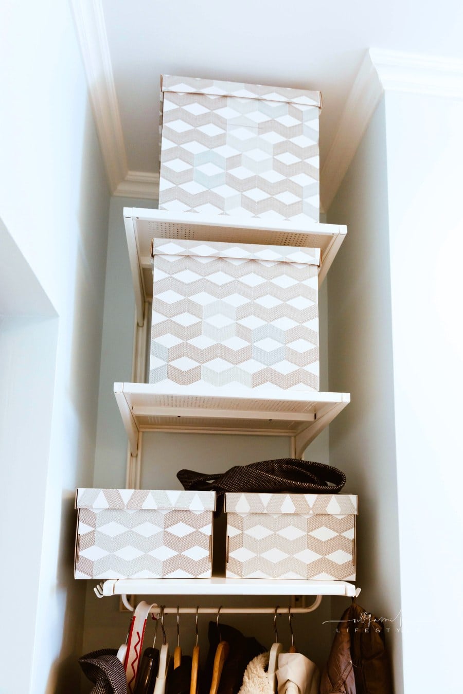 Clothes stacked in organized boxes in the closet. Minimalism, declutter your home