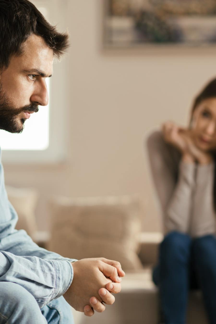 Young couple having problems in their relationship at home