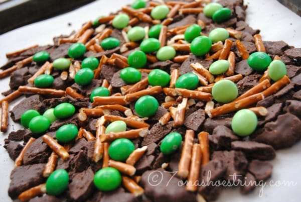 crushed chocolate mint cookies with pretzels and green M&Ms