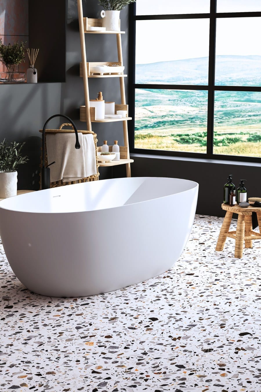Modern cozy bathroom interior with beautiful bathtub and terrazo floor
