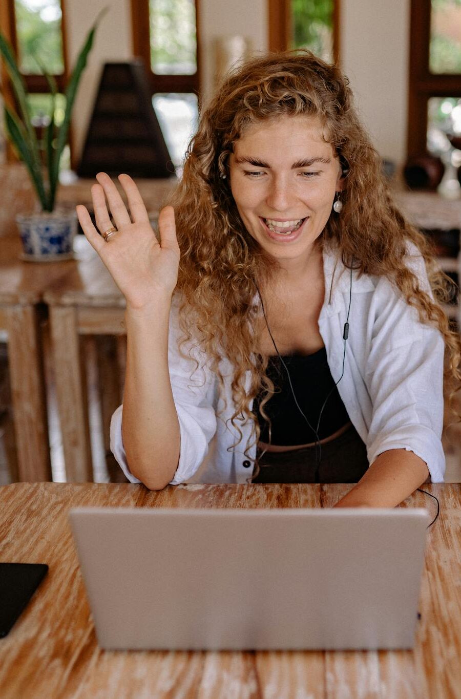 A mother and her son engaging in a joyful video call, sharing a family moment at home.