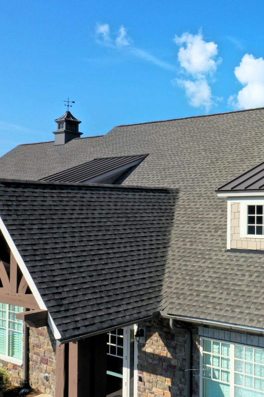 modern house with metal and asphalt shingle roof