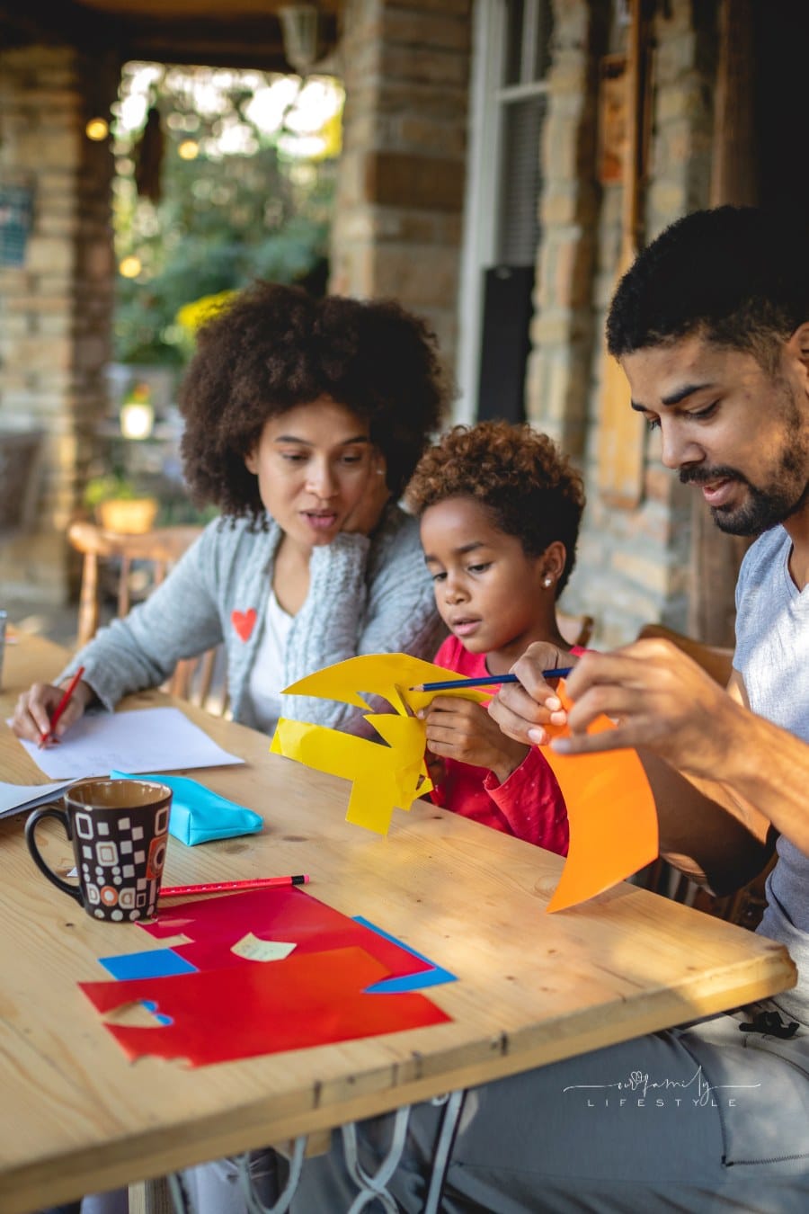 Family of three doing a art project