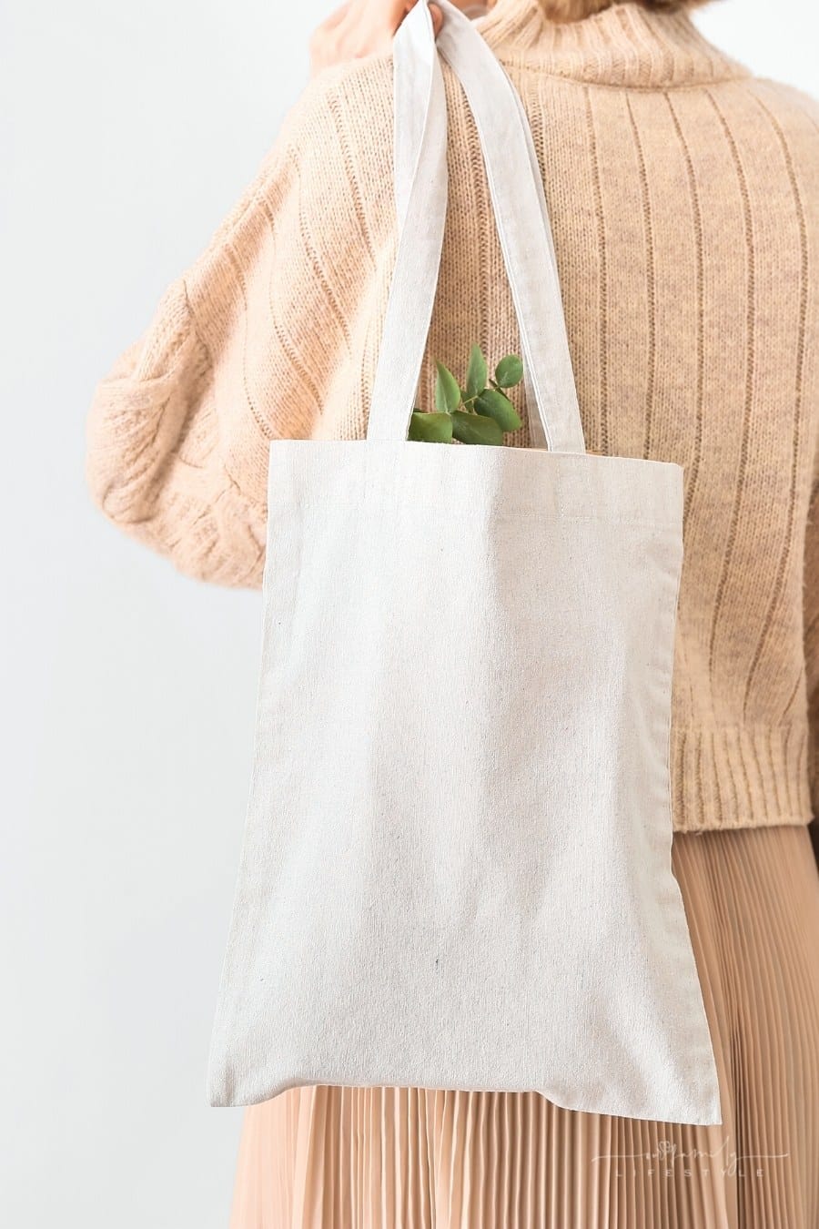 woman with tote bag over shoulder