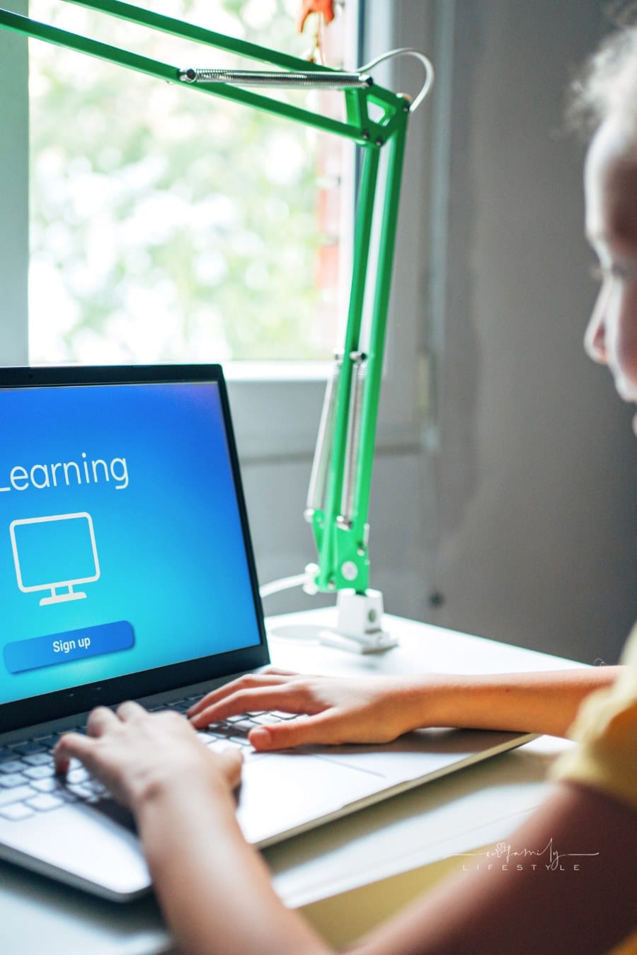 young student watching online lessons and studying from home