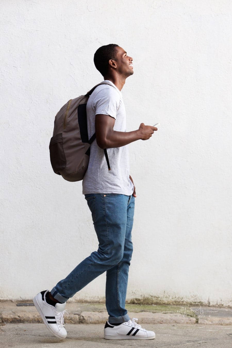 Smiling Male College Student wearing a backpack