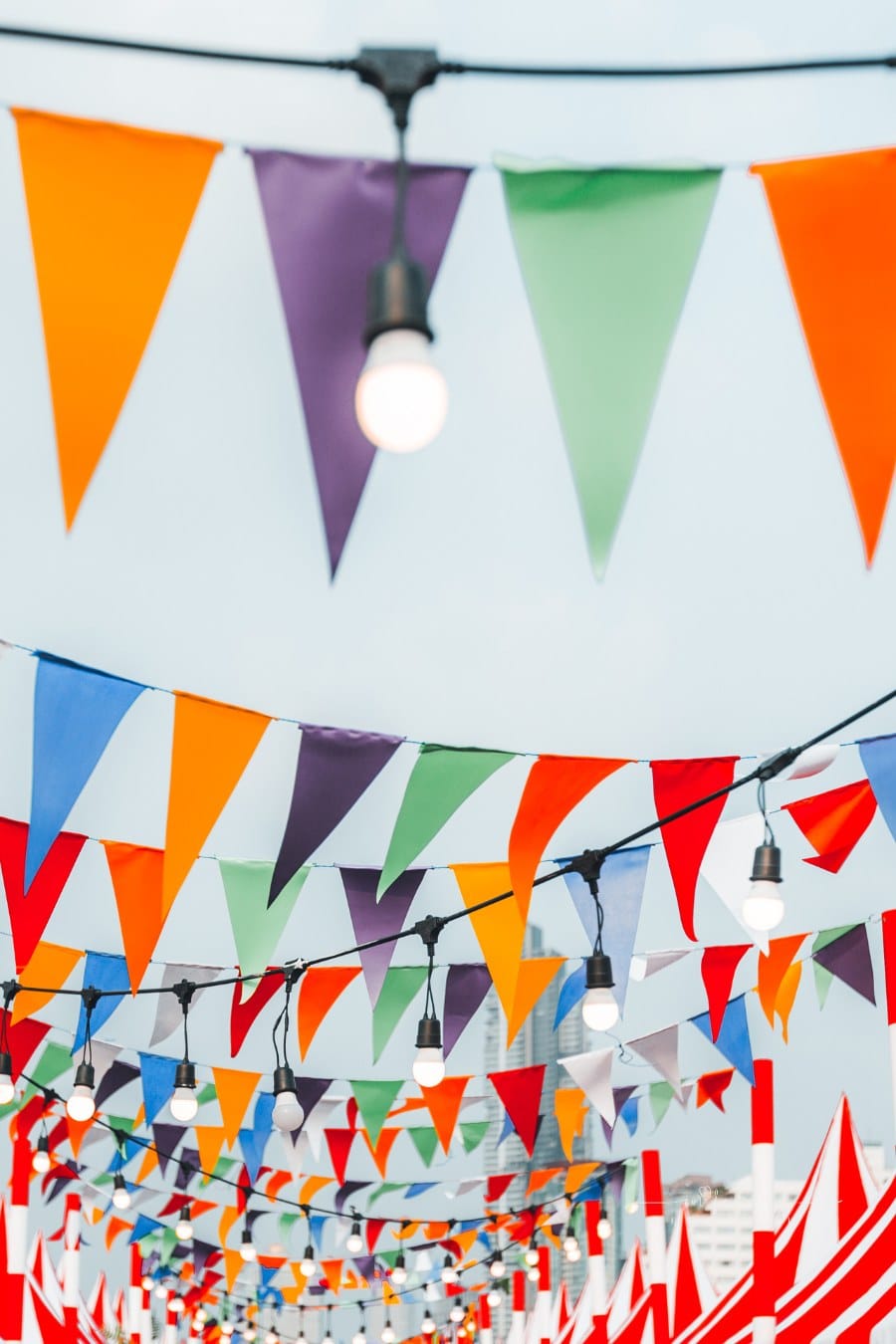 bright colored pennant banners and string lights hanging across sky