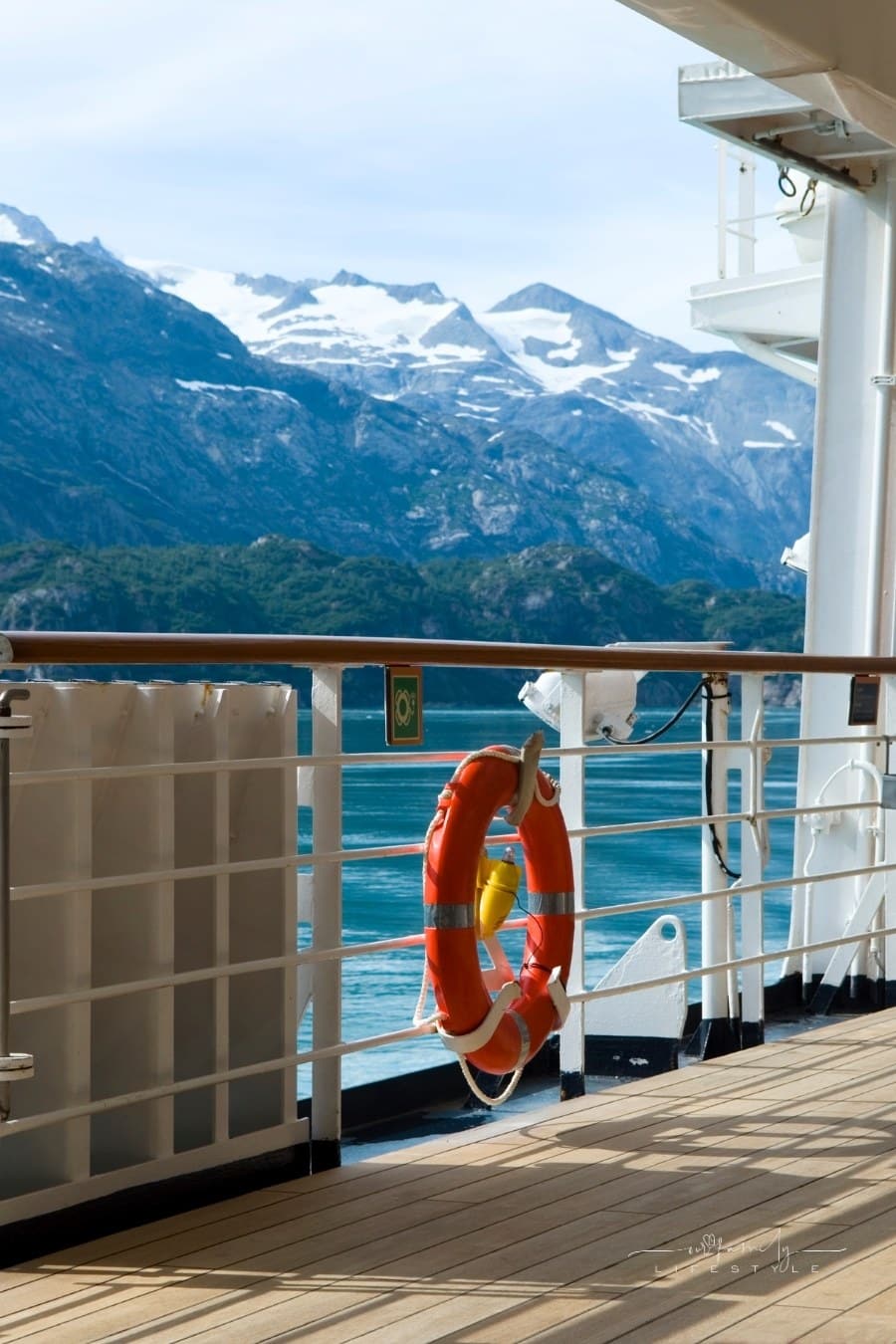 snow capped mountains from deck of an Alaskan cruise ship