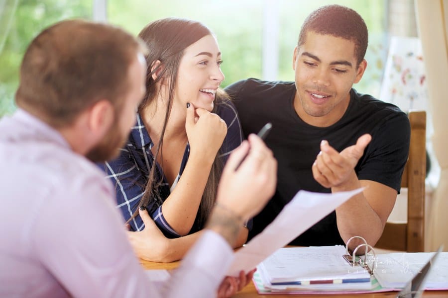 landlord and tenants going over rental contract