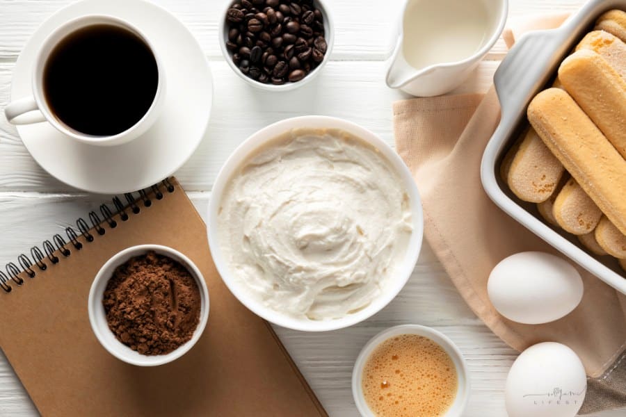 Tasty tiramisu ingredients arrangement flat lay