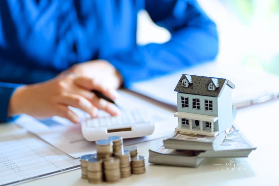 Saving money for Real estate investment with with stack of money