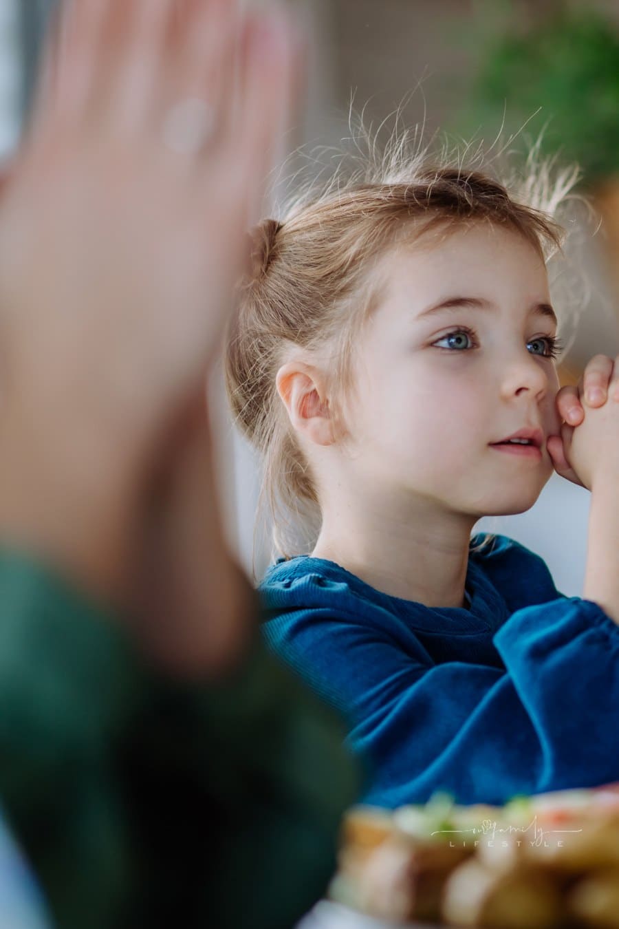 Close-up of Family Praying before Easter Lunch.
