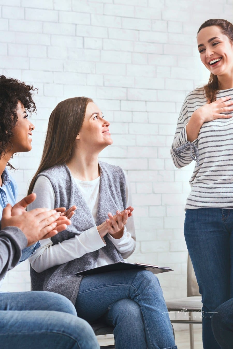Happy welcoming woman at support group meeting,