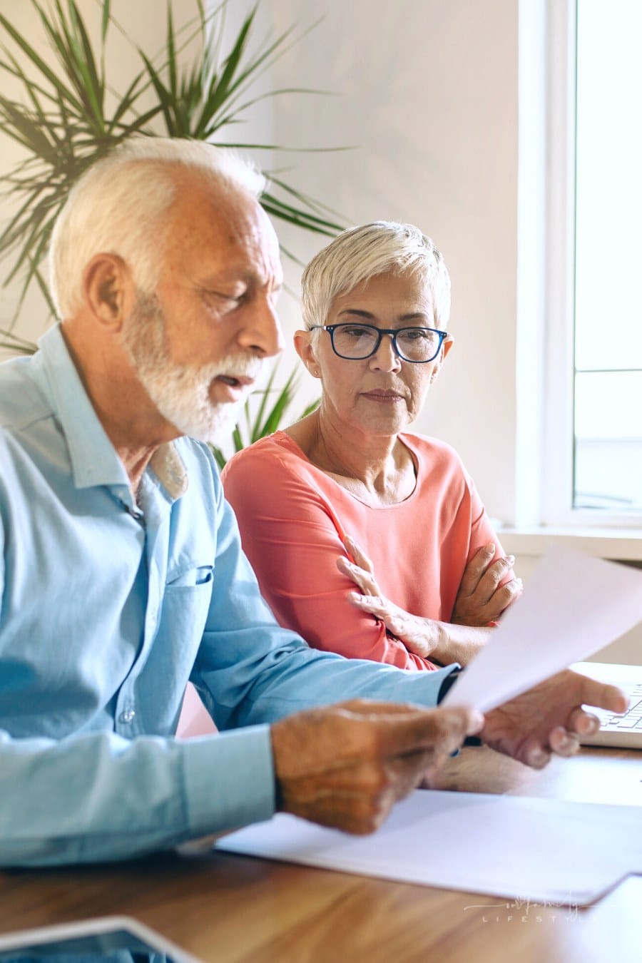 senior couple trying to figure out finances together