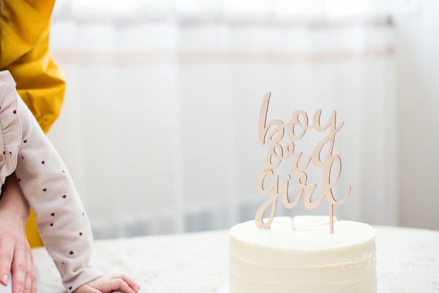 White "Boy or girl" cake for gender reveal party