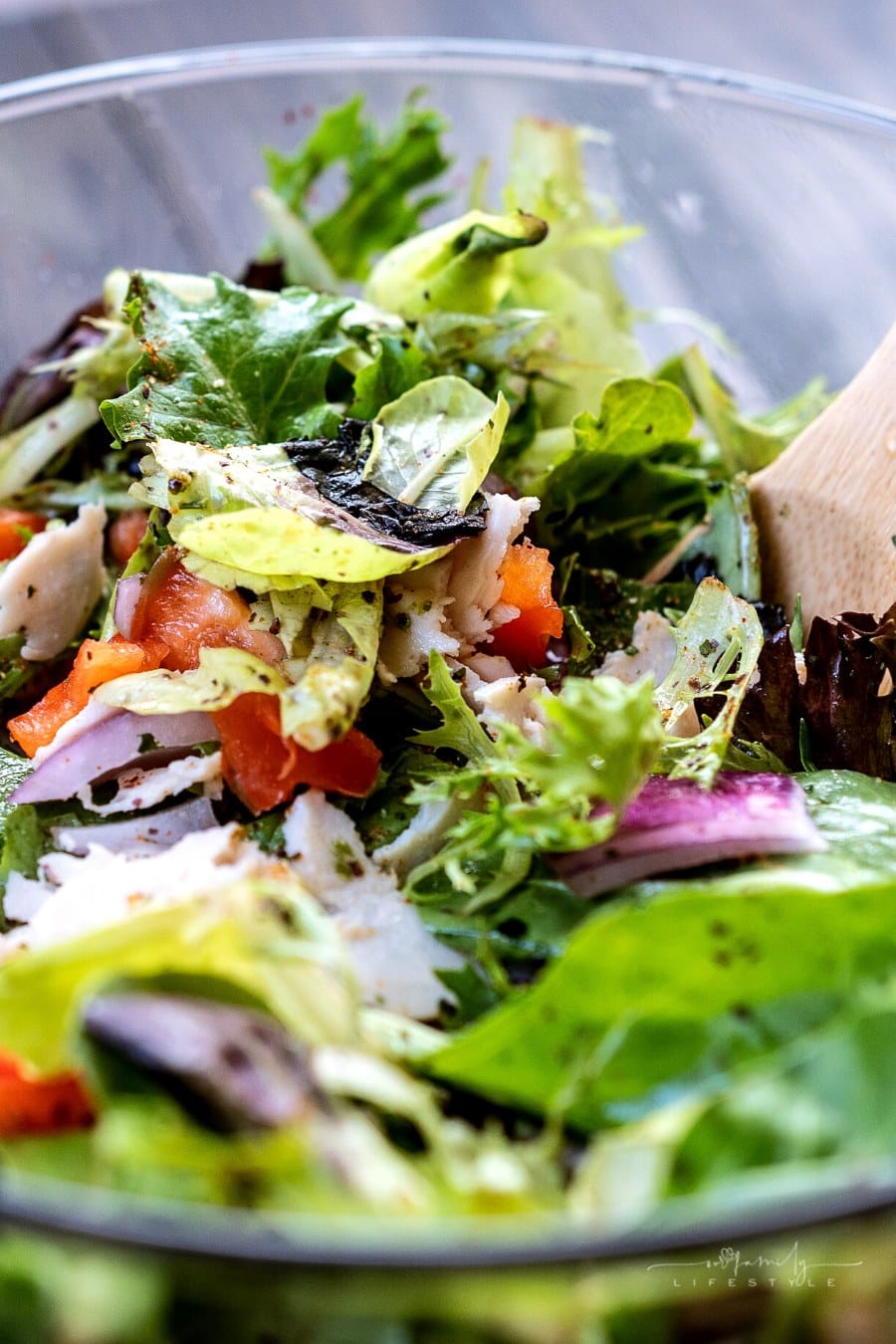 glass bowl filled with grilled chicken salad