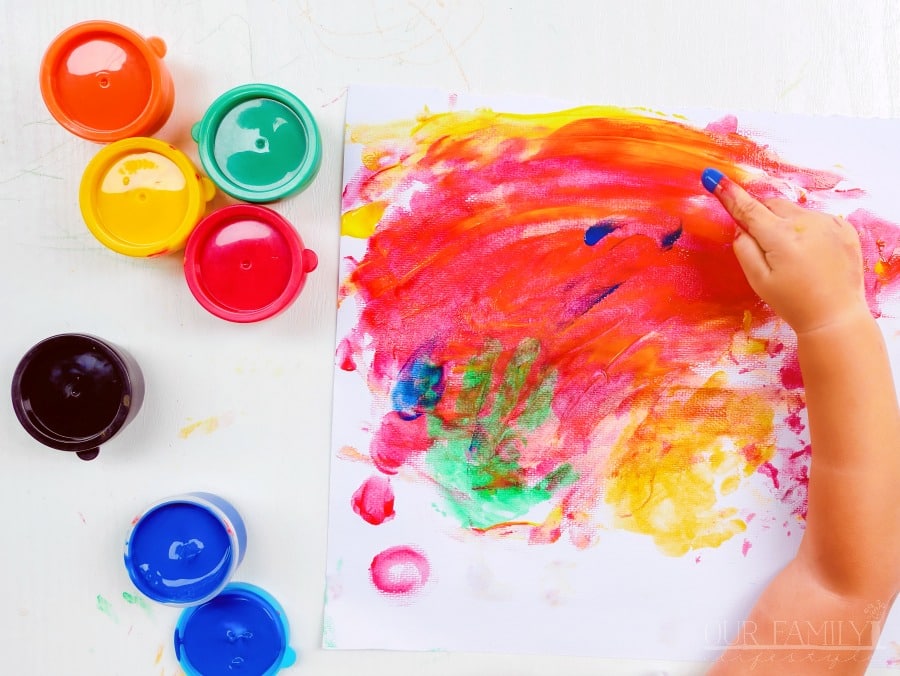 child finger painting
