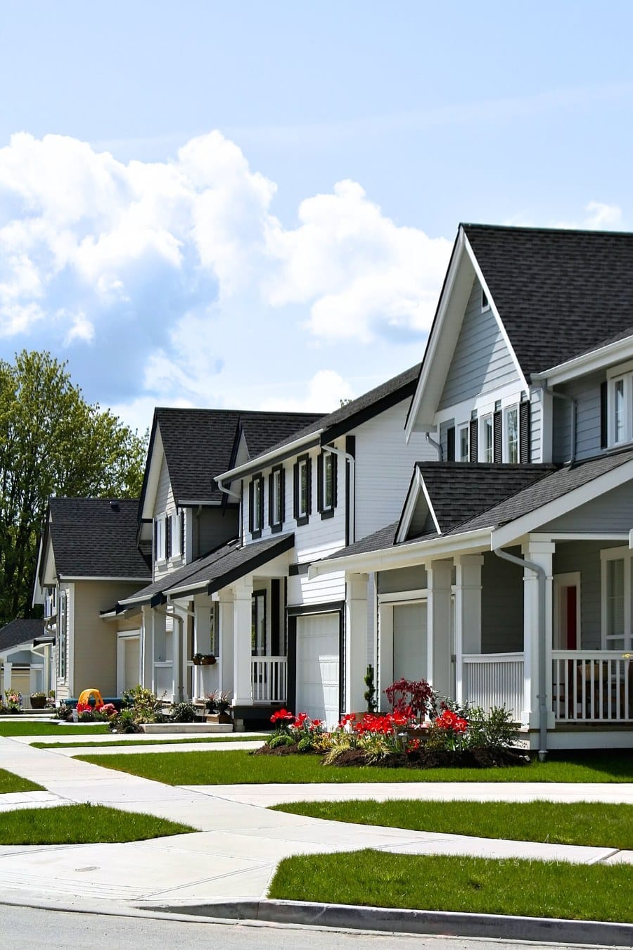 Friendly residential neighborhood, child's toy visible in the background.