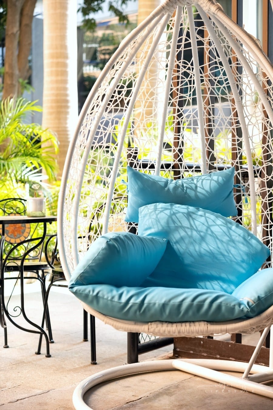 hanging modern garden swing with teal cushion