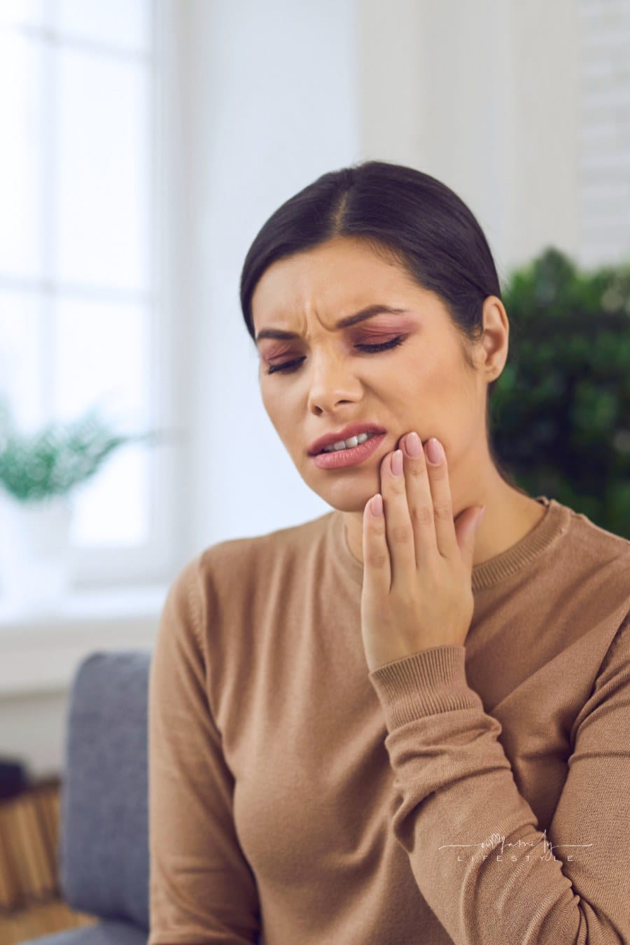 Unhappy Woman Suffering from Jaw Pain