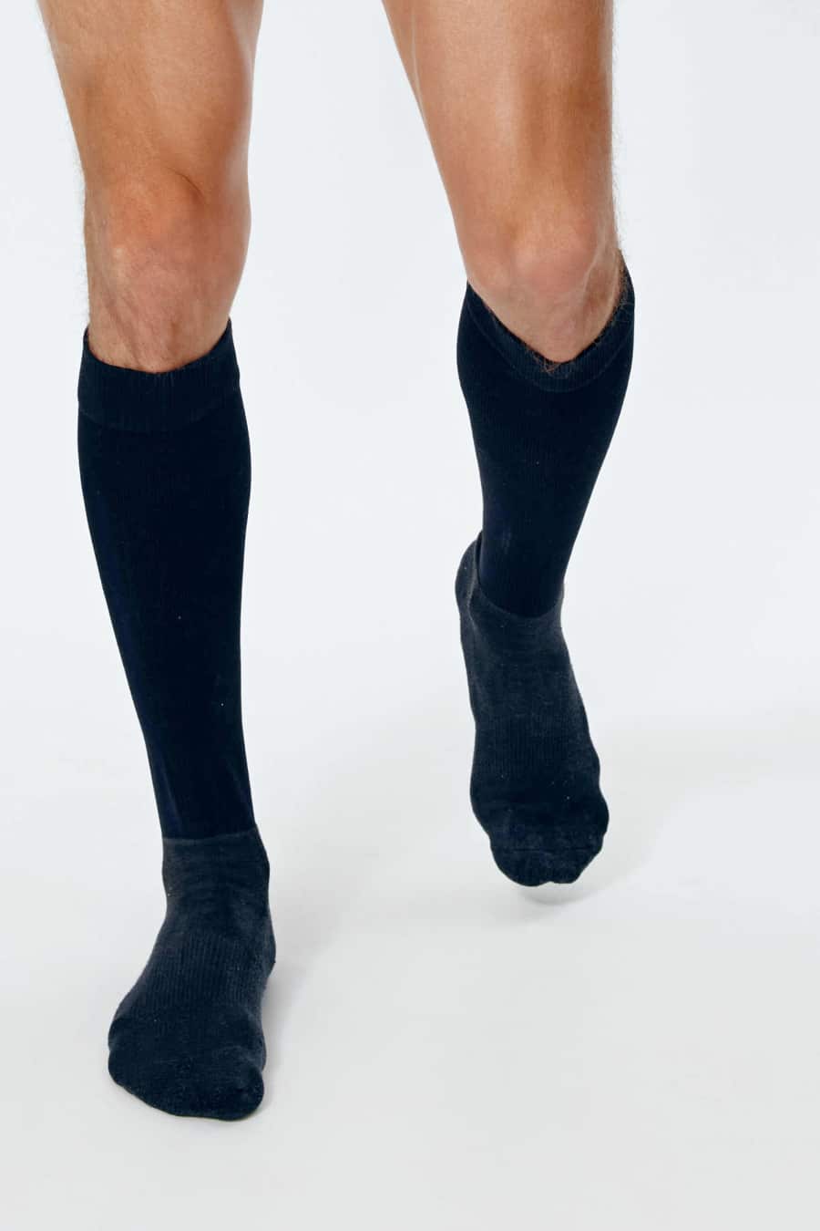 long black socks on man's legs facing forward