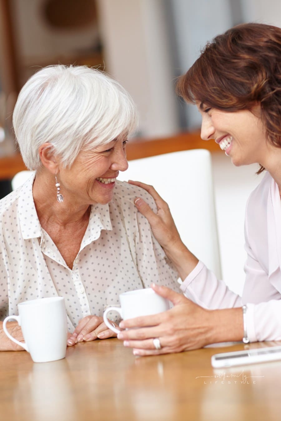 Shot of a senior woman and her daughter chatting over coffee.