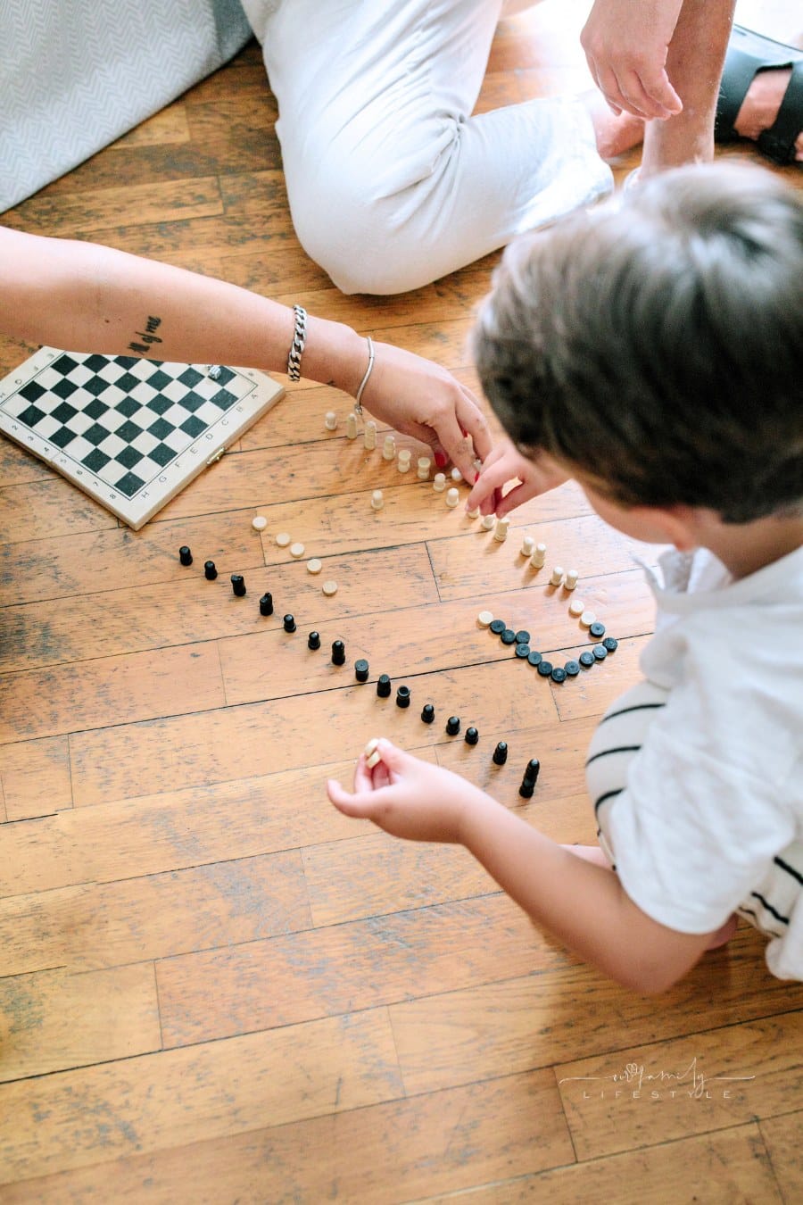 Parent and Child Playing with Board Games