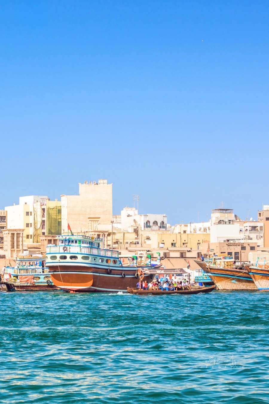 Dubai Creek scenery with abras, traditional ferry ships made of wood