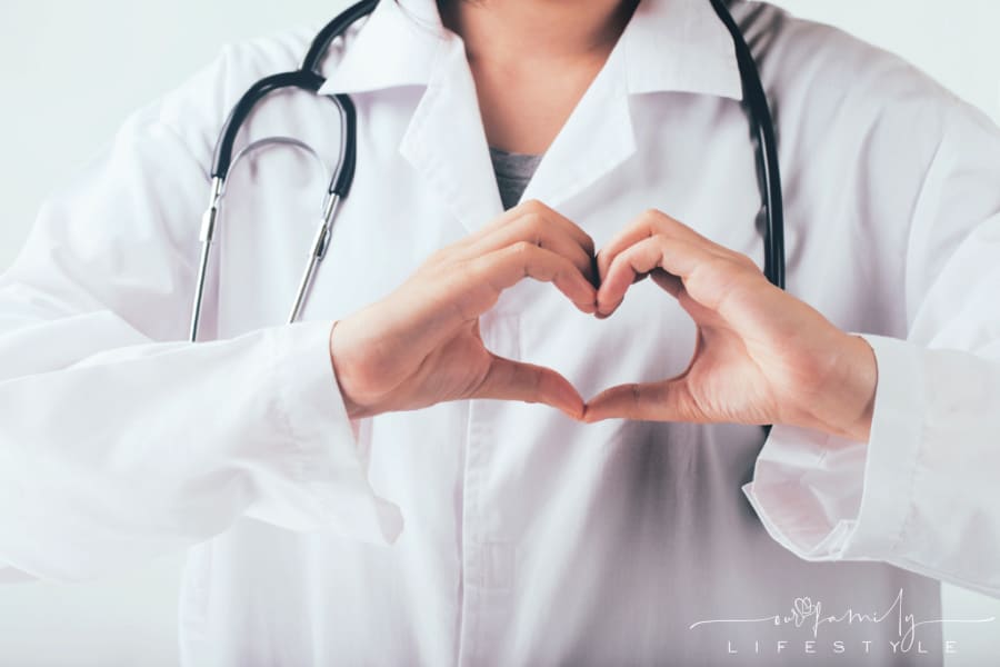 Doctor making hands in heart shape