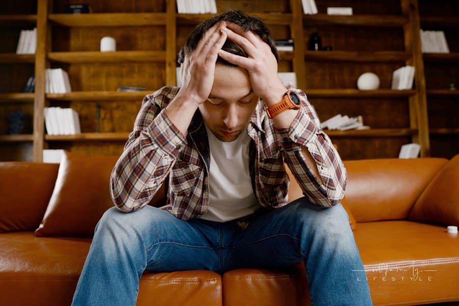 Alcohol addiction at young age. Caucasian male cannot stop drinking alcohol, drunken lonely male drinks wine from bottle. Lon