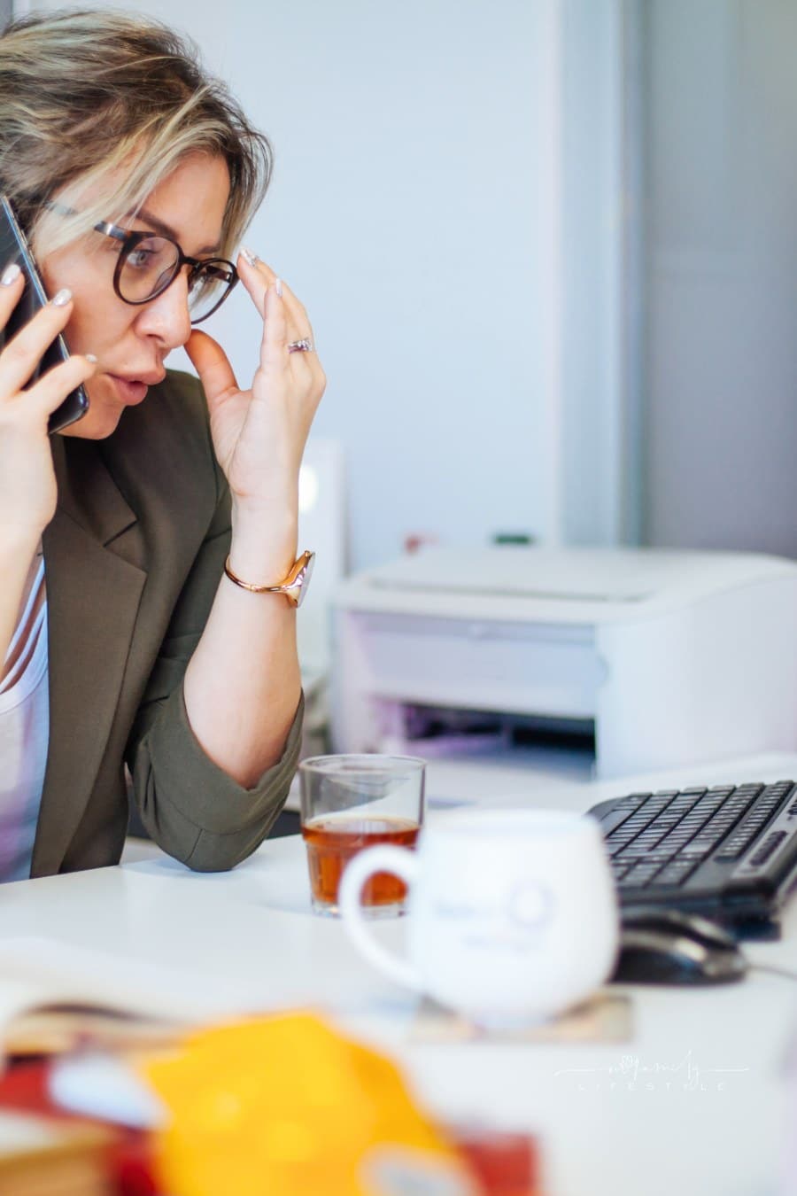 woman talking on phone in office