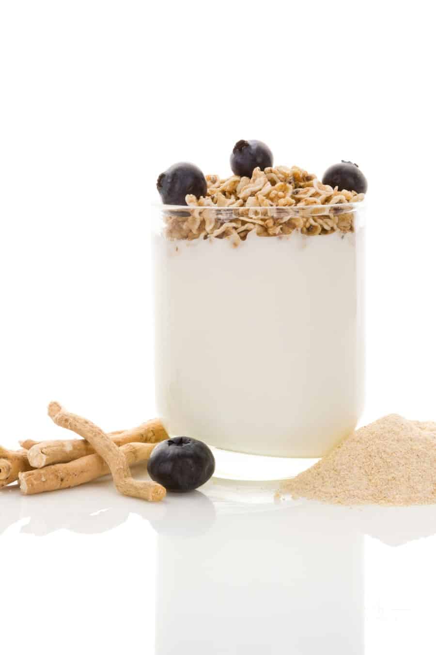 cup of yogurt with blueberries and Ashwagandha