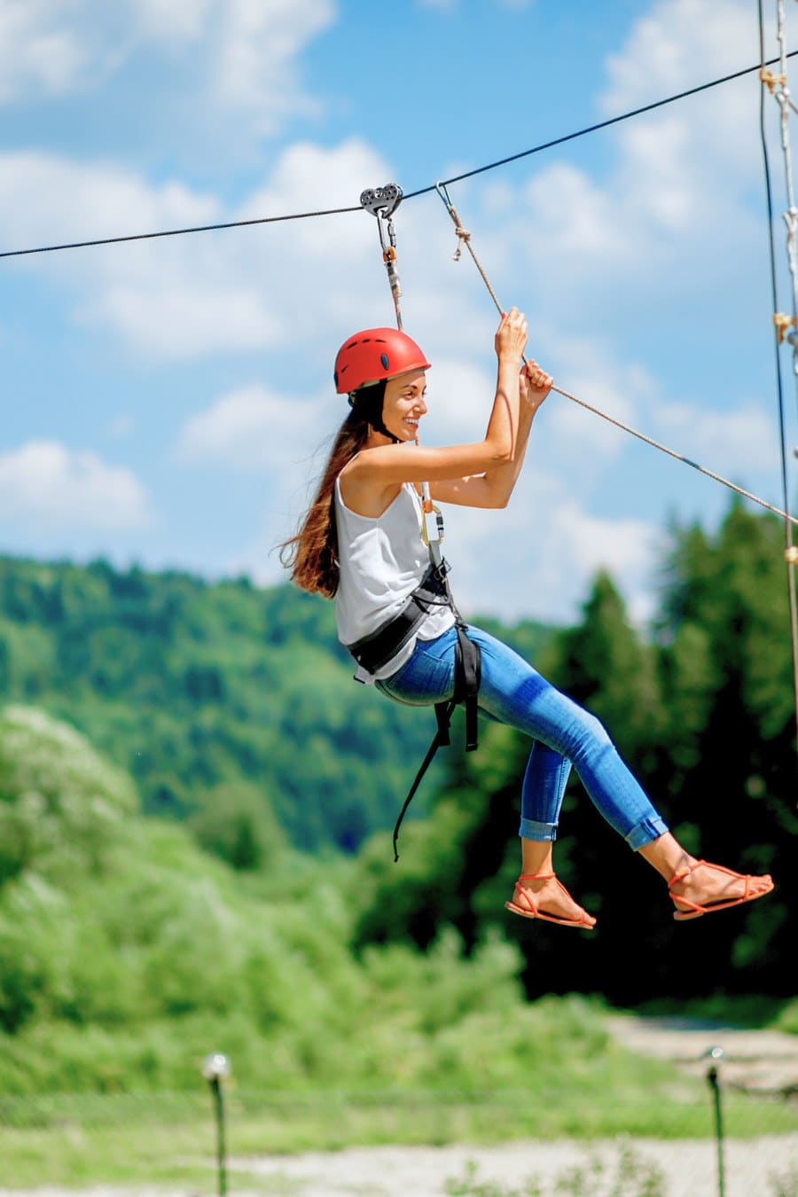 young woman on a zip line