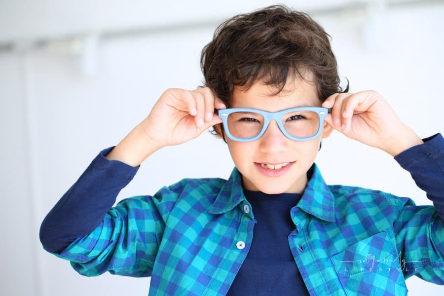 Young Boy Trying on His New Glasses