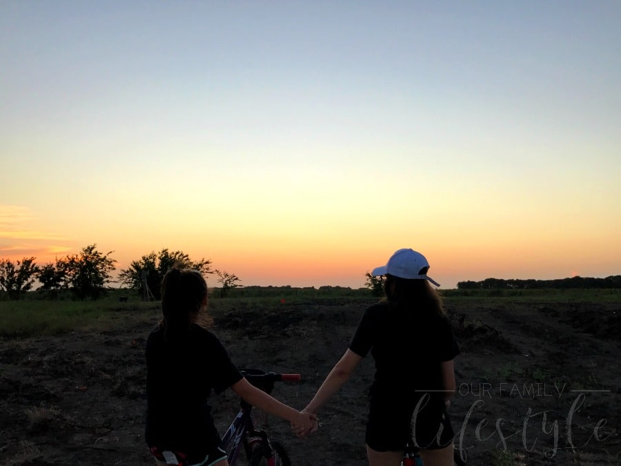 family bike ride at sunset