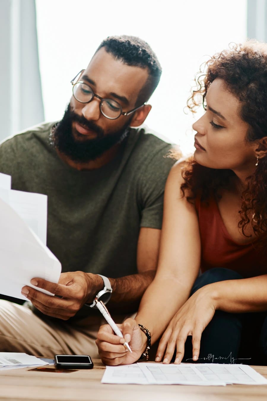 Young couple working on Financial planning to meet their current and future needs