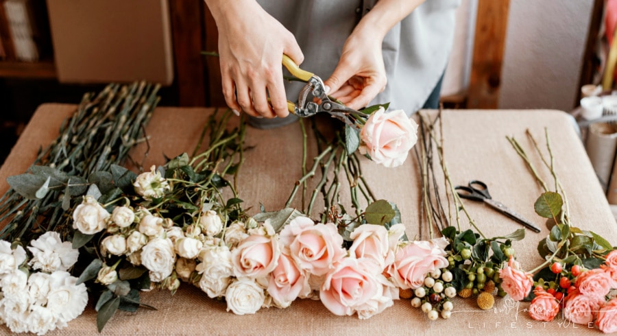 florist making beautiful floral bouquet