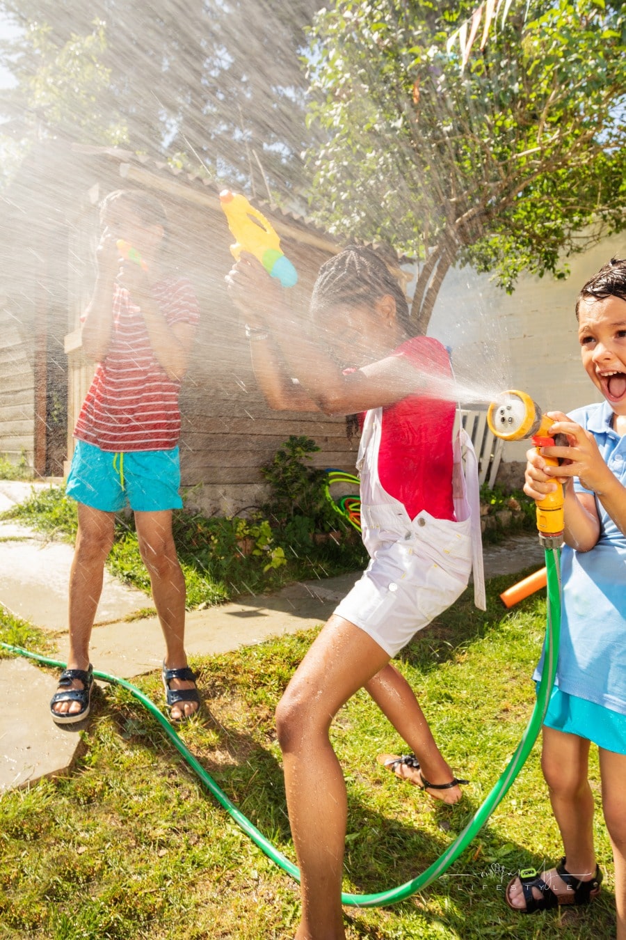 kids having fun engaging in water fight