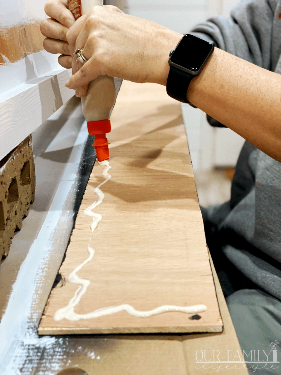 glue faux shiplap to bench