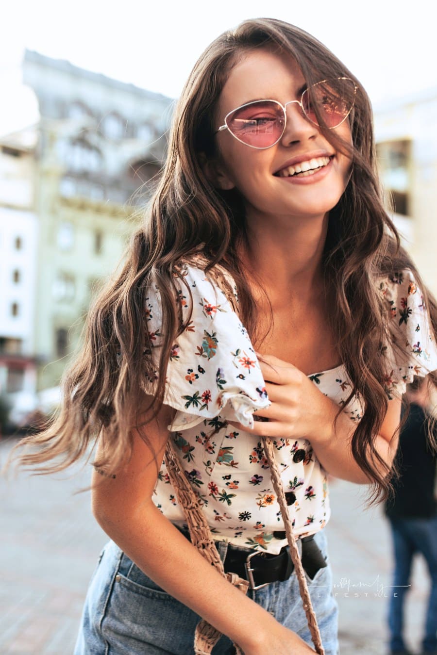 Happy Brunette Woman in Floral Blouse and Trendy Pink Sunglasses