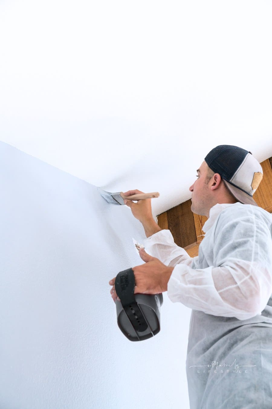 Professional painter painting room